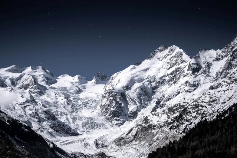 the top of some mountains are covered with snow