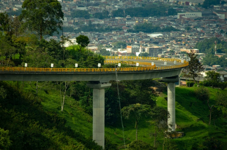 the long bridge has yellow seats on top of it