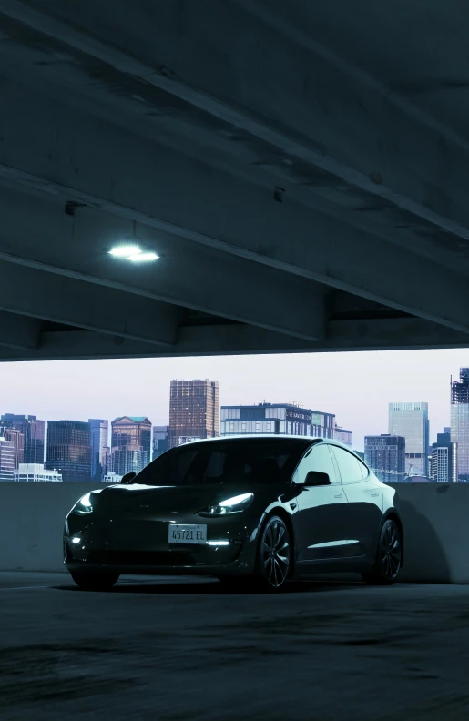 an electric car sits in a parking garage