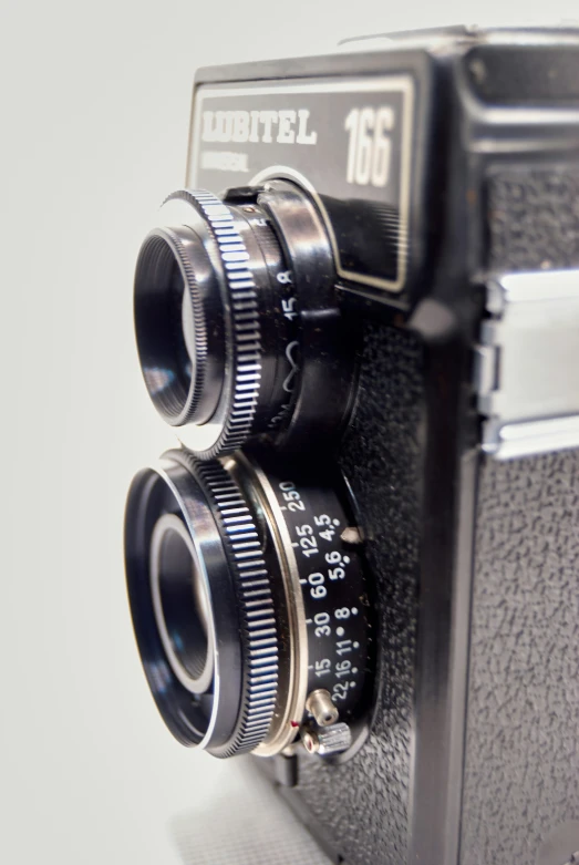 an old - style camera has a silver lens