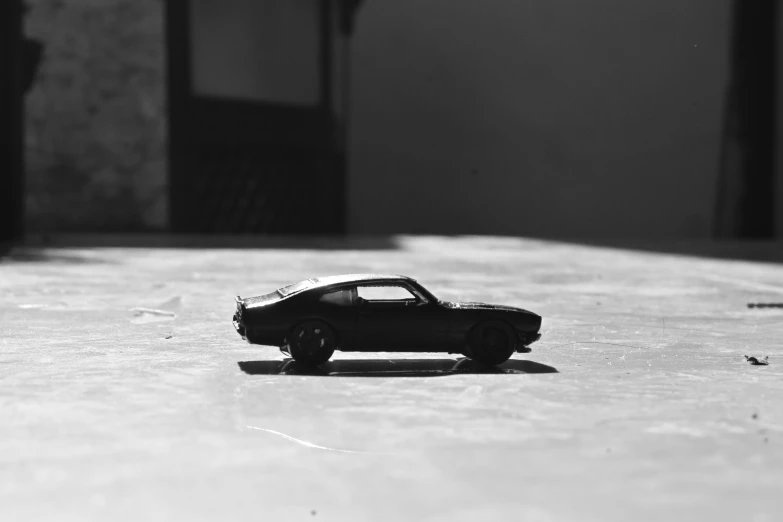 black and white po of a toy car