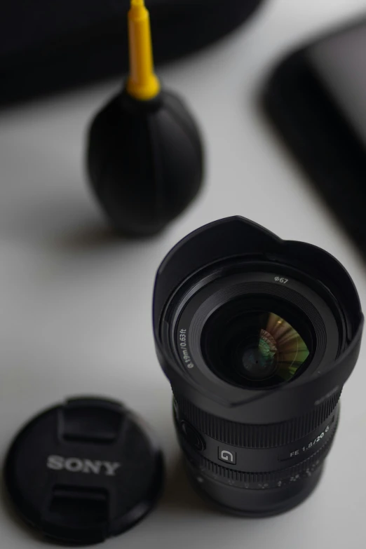 a camera lens with its lid on a table