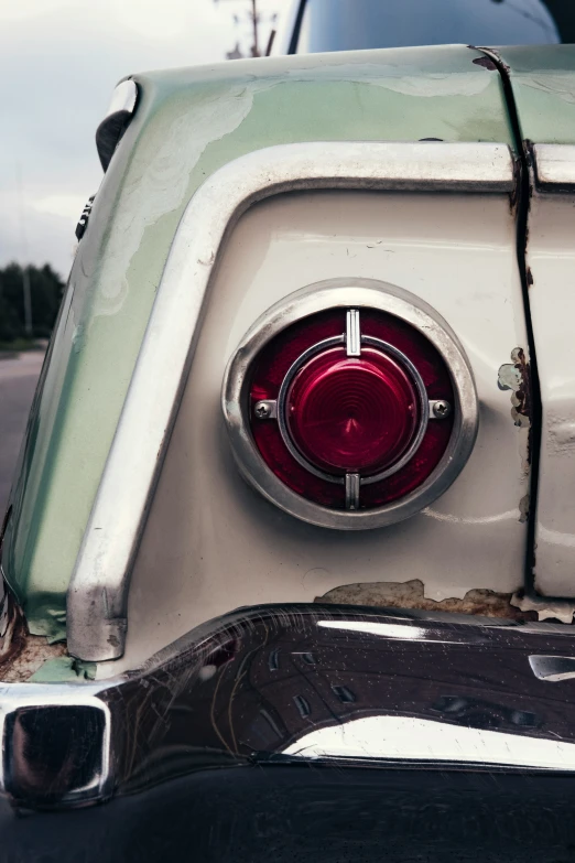 an old, damaged and dirty vehicle with its trunk out