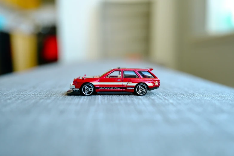 a small toy car with wheels on the floor