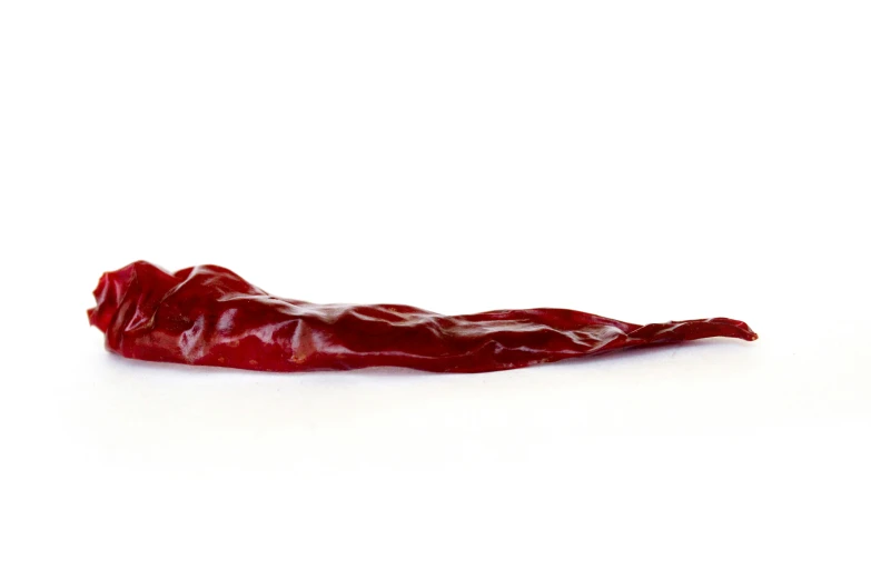 a long red  chili that is split in half