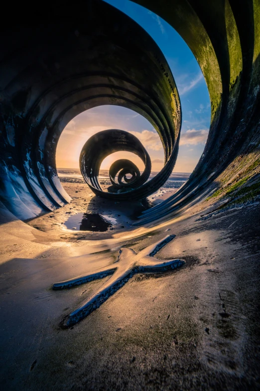 an unusual wave tunnel with a long beach underneath it