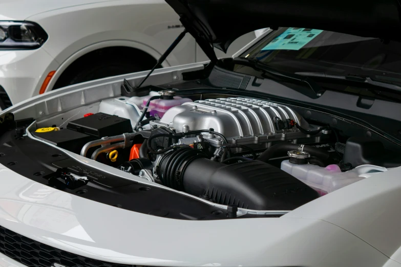 the engine compartment of a car showing it's turbo