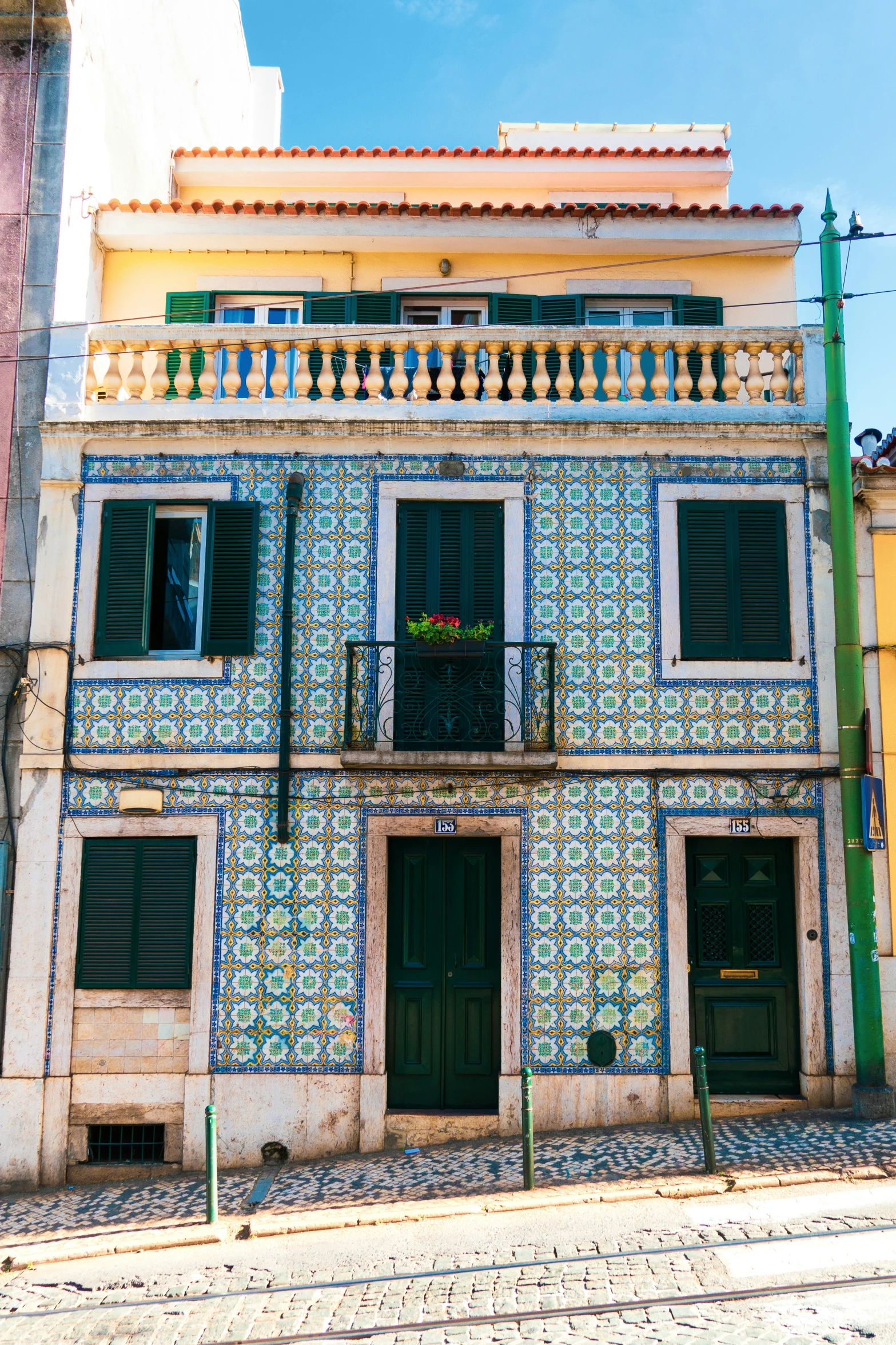 a building covered in bright blue and white tiles