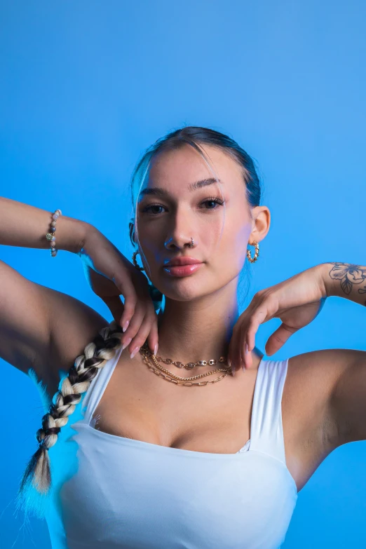 a beautiful woman wearing a tank top posing for a po