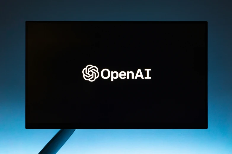 the open ai logo is displayed against a blue background