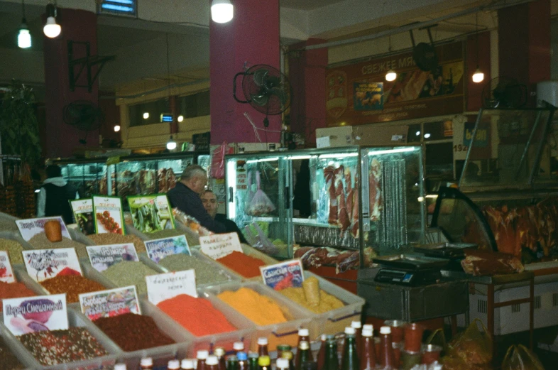 there are some shops with spices on the counter