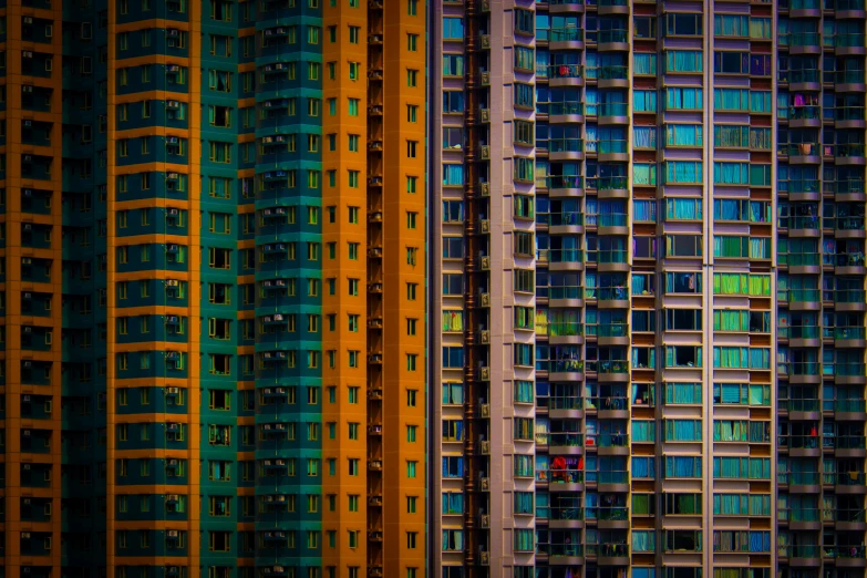 a series of abstract, multicolored buildings on a street