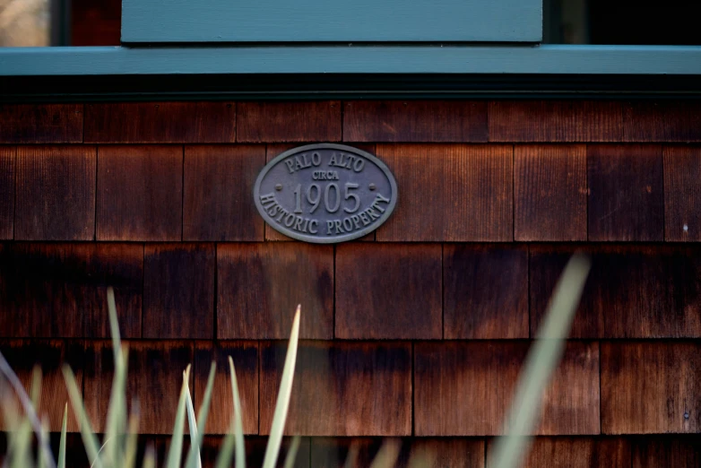 a close up of a sign on the side of a building