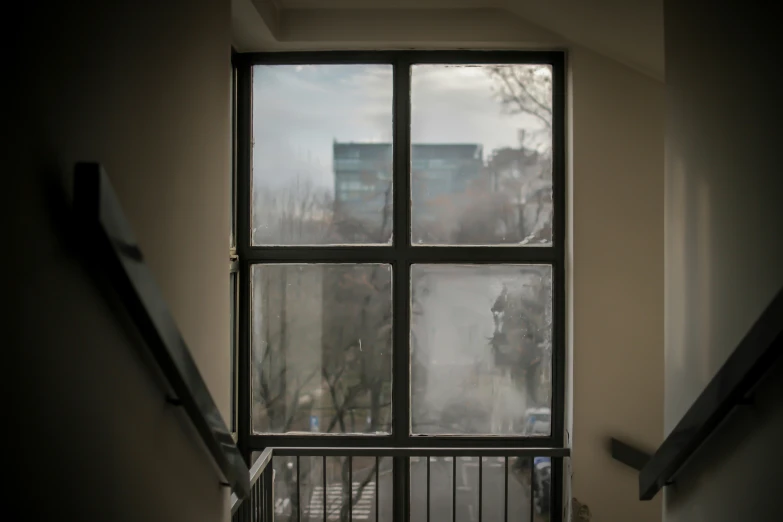 looking out the window in an apartment building