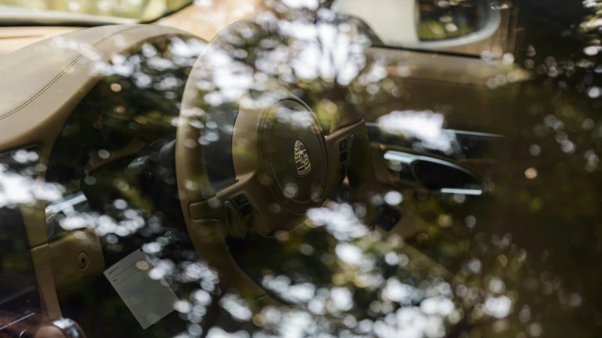 the interior of an automobile with its driver steering wheel visible