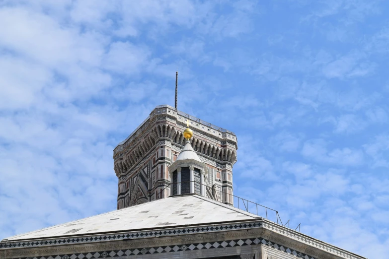 a large tall tower under a blue sky