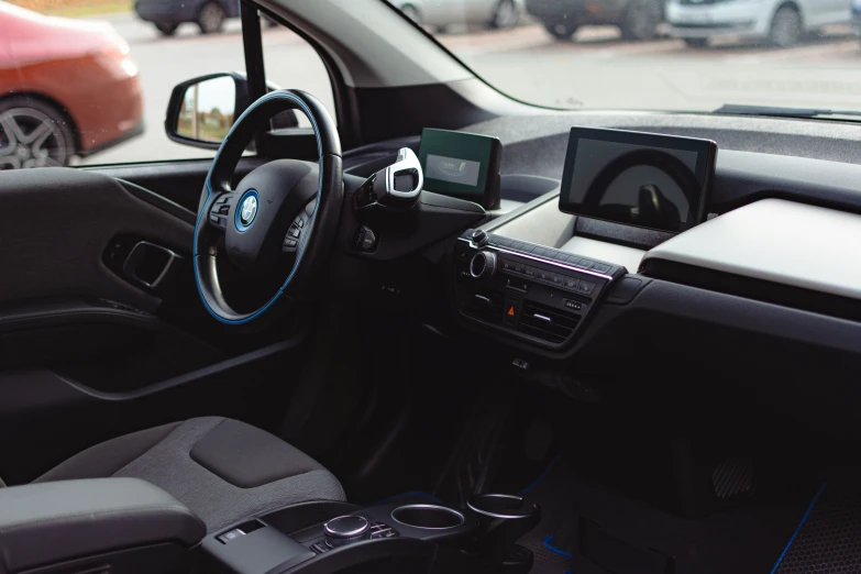 a small car with a blue dash board and steering wheel