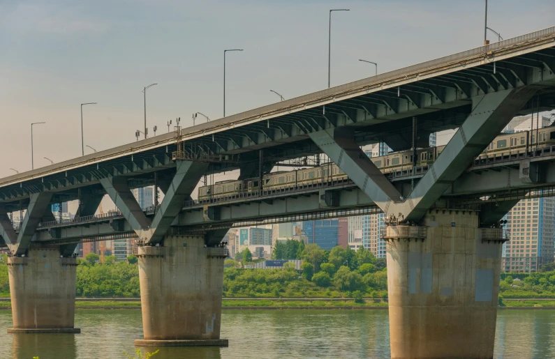 a train on top of a bridge above a body of water