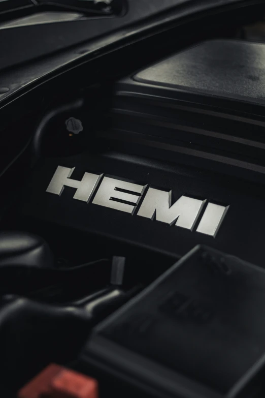 the hood of an suv with the word hemi painted on it