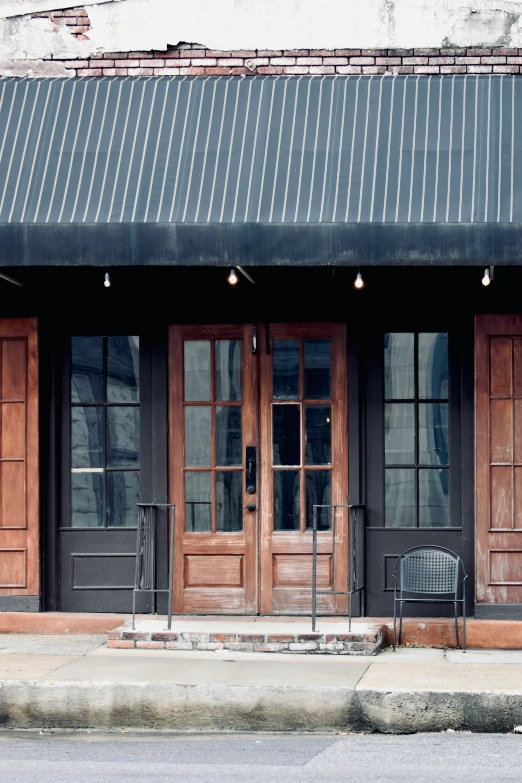 a couple of big doors sitting outside of two buildings