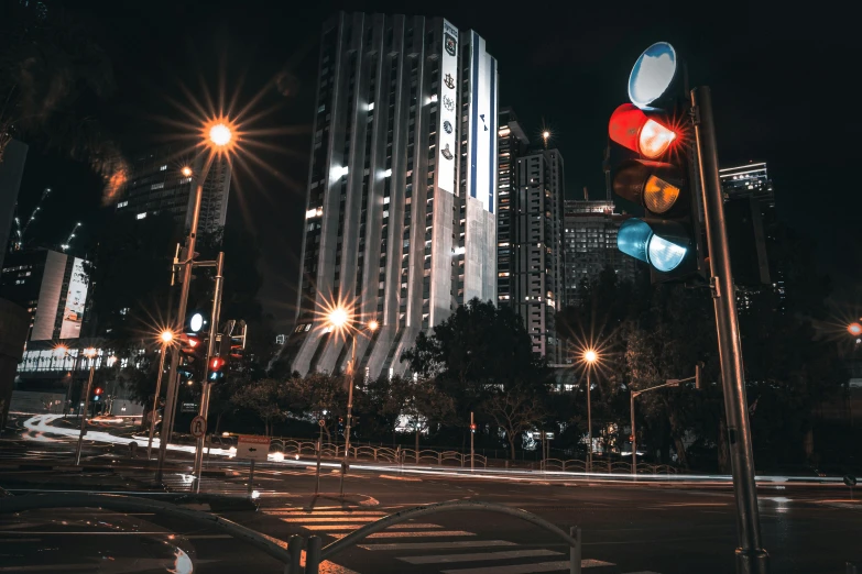 the city is lit up at night with no one driving