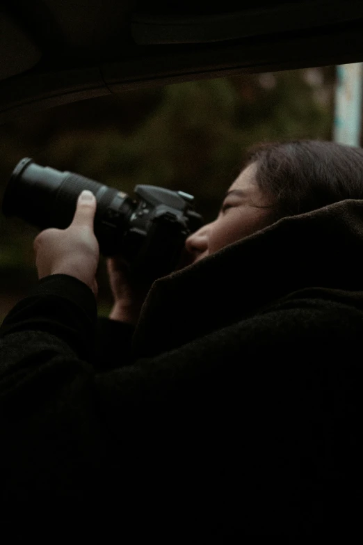 a person taking pos with their camera on a train