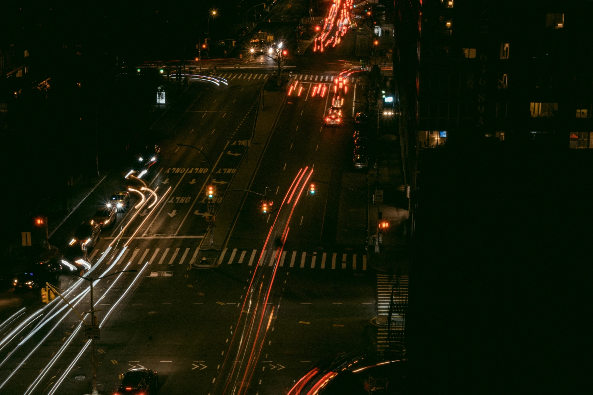 busy street at night with all of the lights on