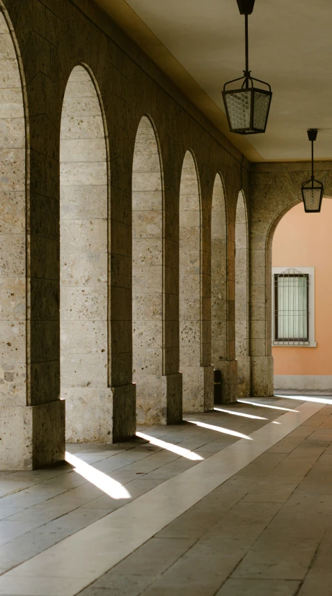 an old building that is lined with columns