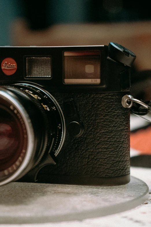 an old fashioned camera with a lens near it