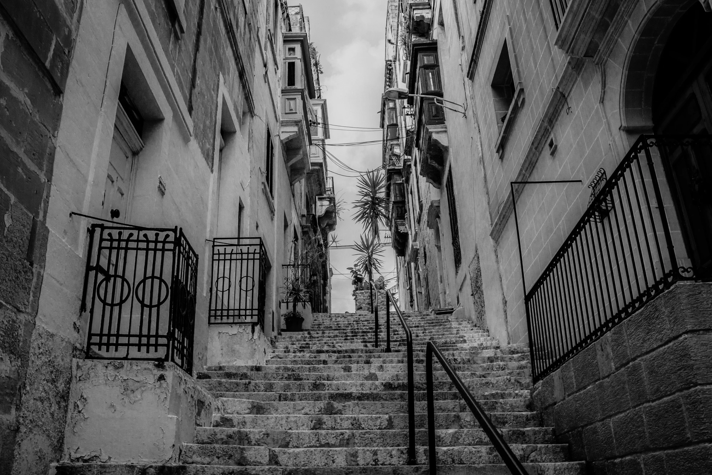 a city street with steps leading to two buildings