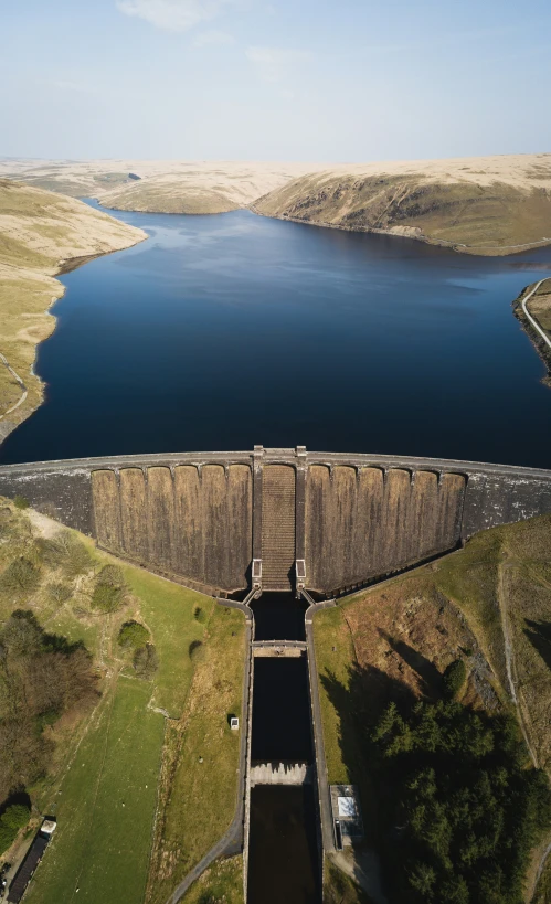 a large reservoir is shown on the side of a hill