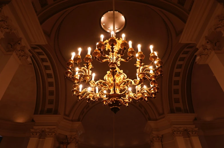 the chandelier is made of glass candles