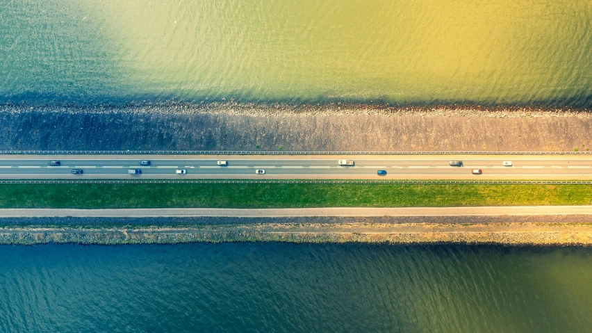 an aerial view shows the freeway passing through the water