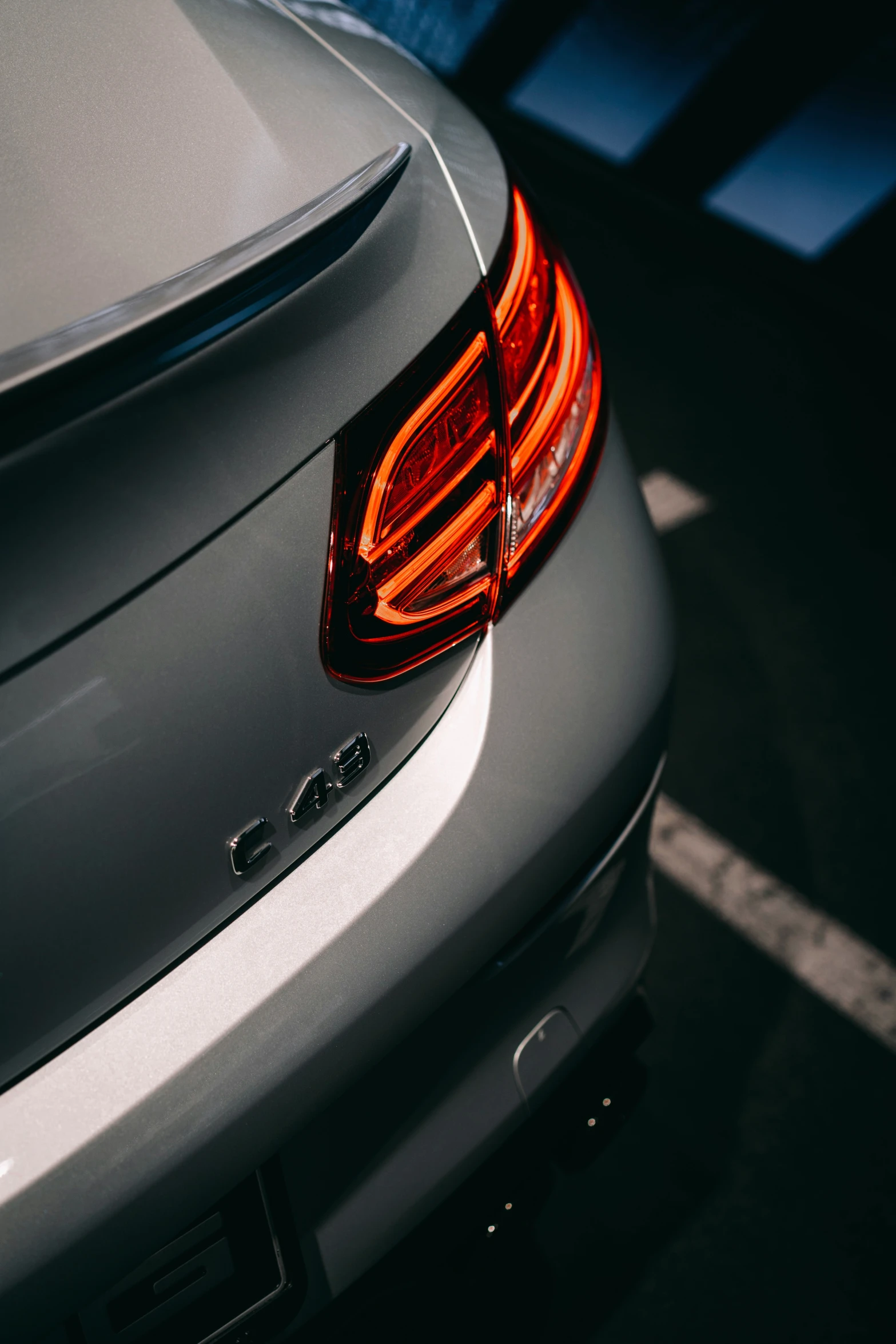 the tail light of a grey bmw car