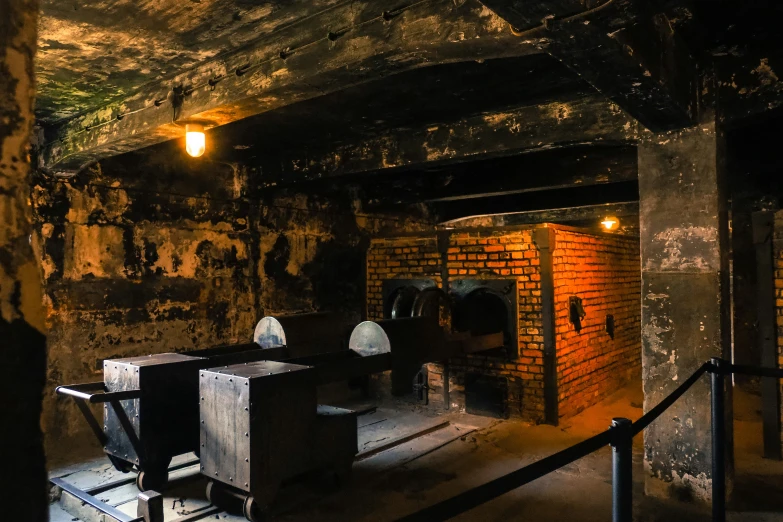 a dimly lit brick room filled with dark objects