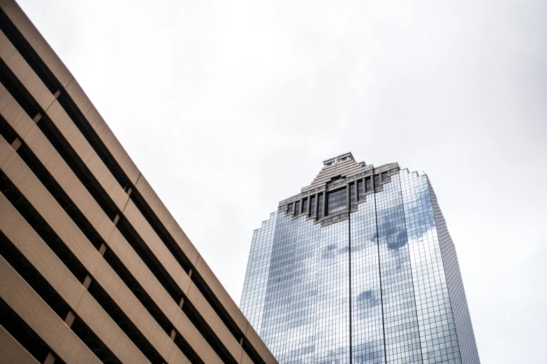 an angled view of the building across the street from it's reflection