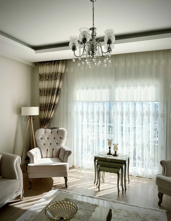 a large living room with a lot of curtains and chairs