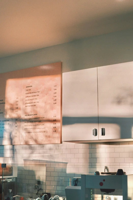 a large menu is hanging in the air above the kitchen counter