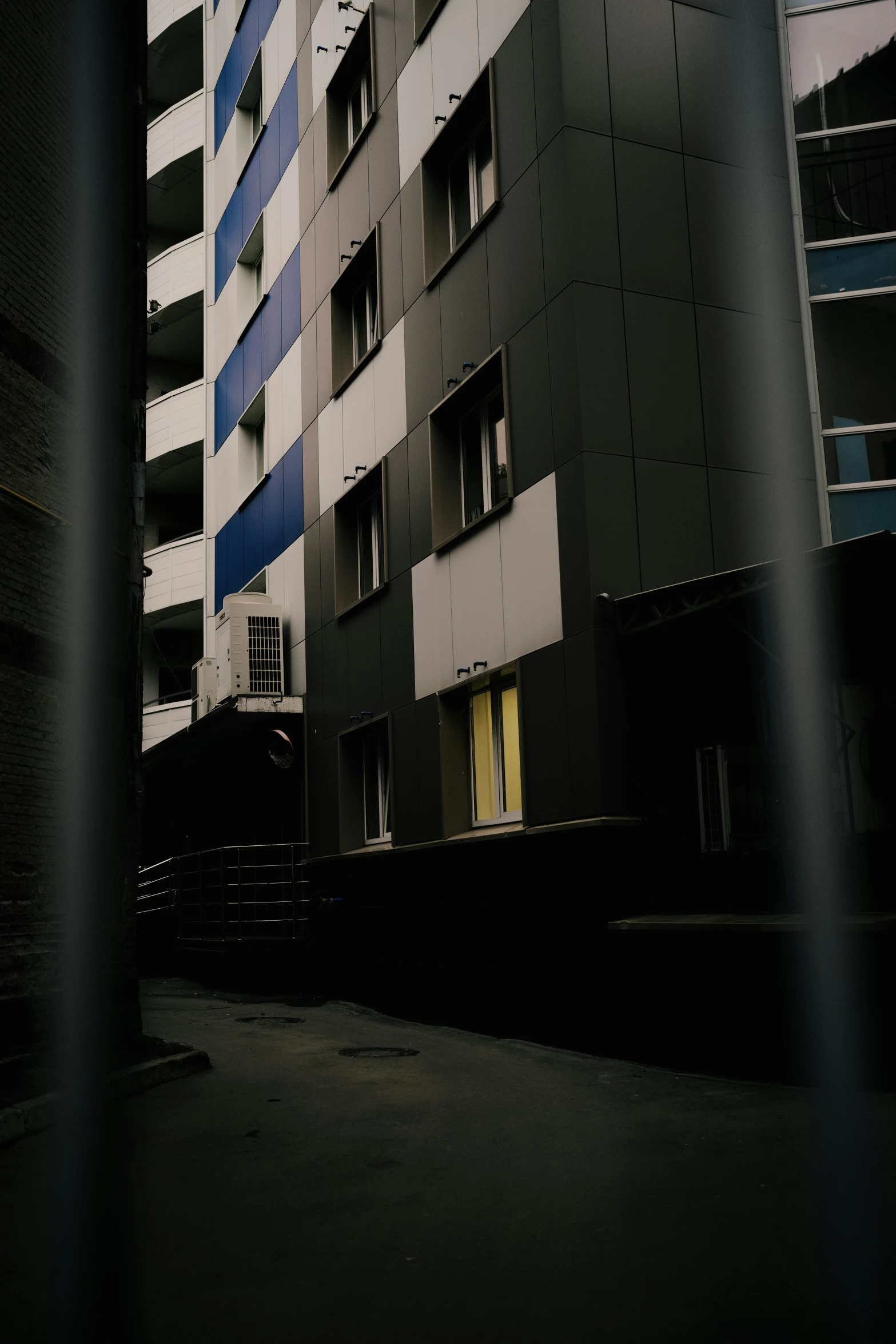 blue and white balconies on the side of a building