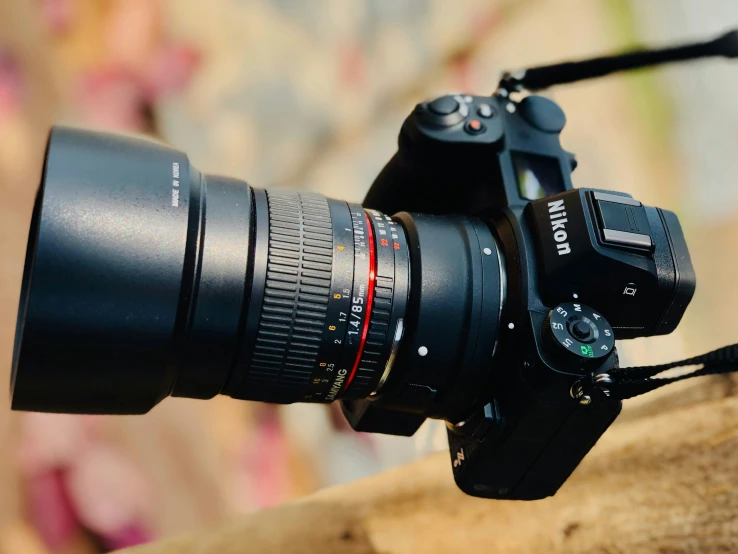 a close up of a lens with its flash light attached