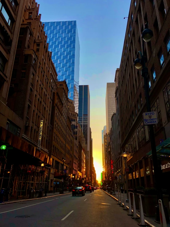 an image of sunset in the city at dusk