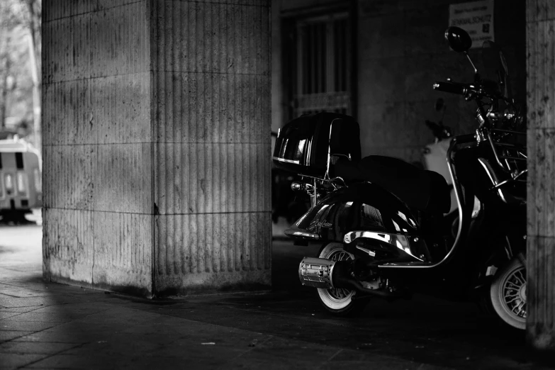 a scooter parked on the side of a street