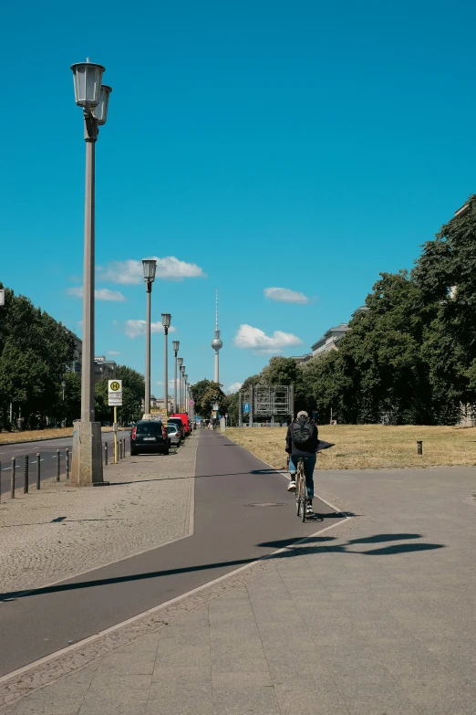 the people are riding bikes through the streets