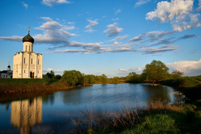 a view of a building sitting on top of a river