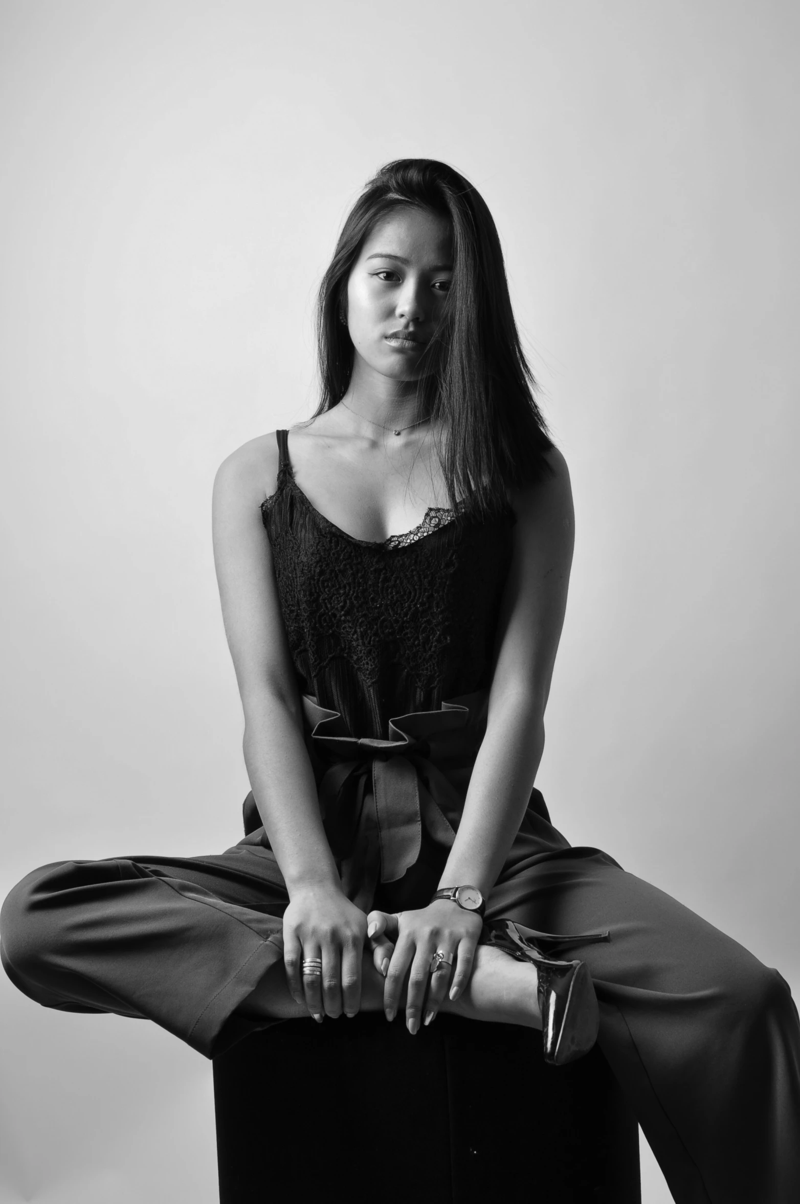 a woman sits in a lotus position with her legs crossed