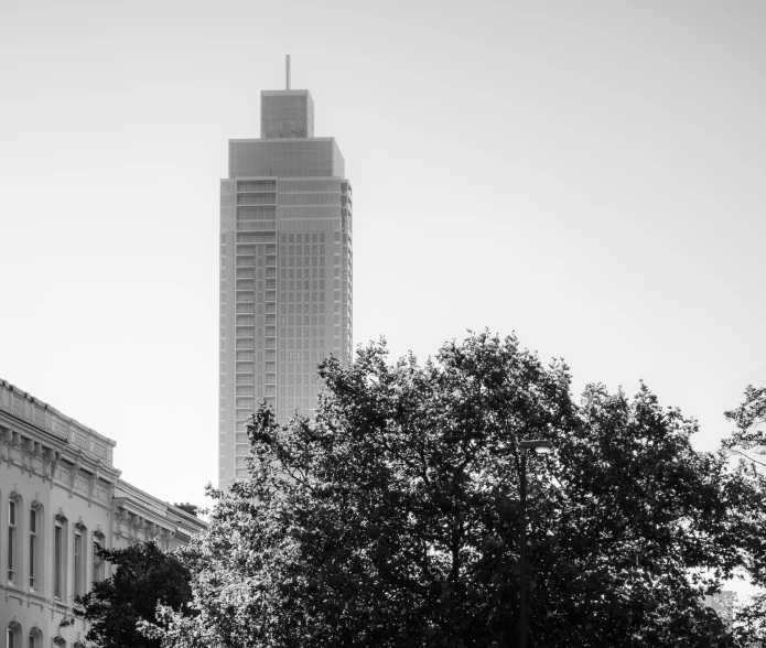 the large tower of a building is high in the sky