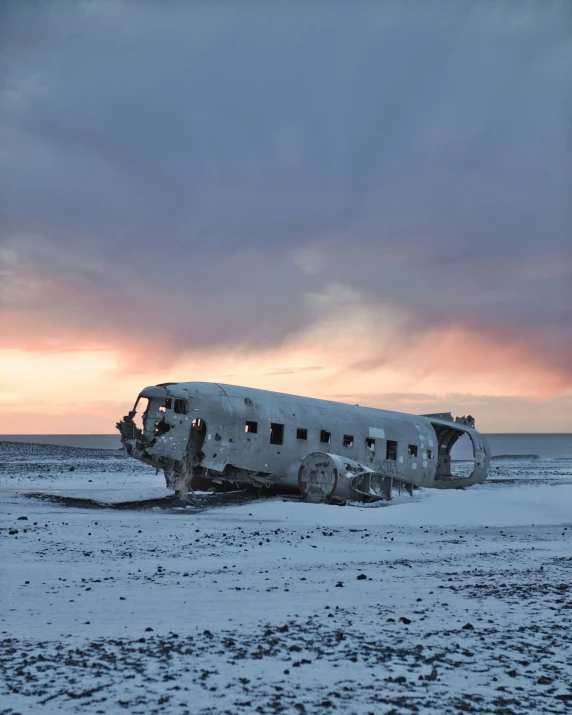 an old airplane is sitting on the snow