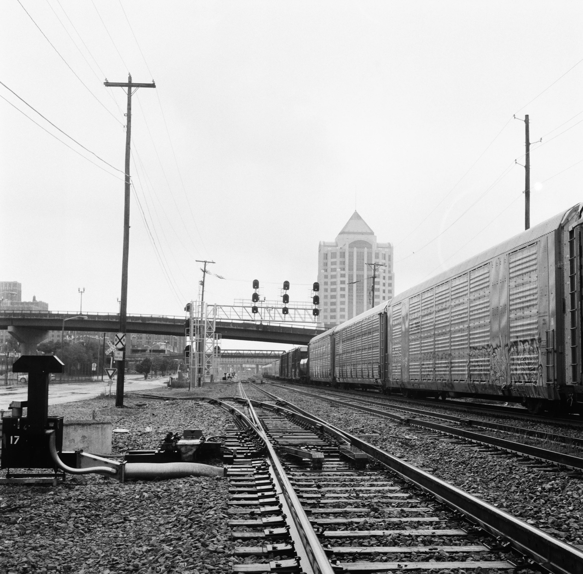 this is a train crossing an overpass on a bridge