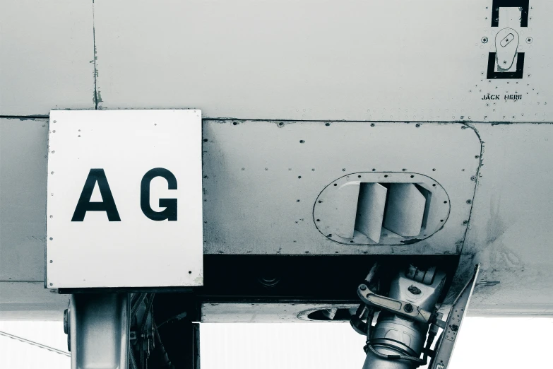 a metal ladder hanging from the side of an airplane