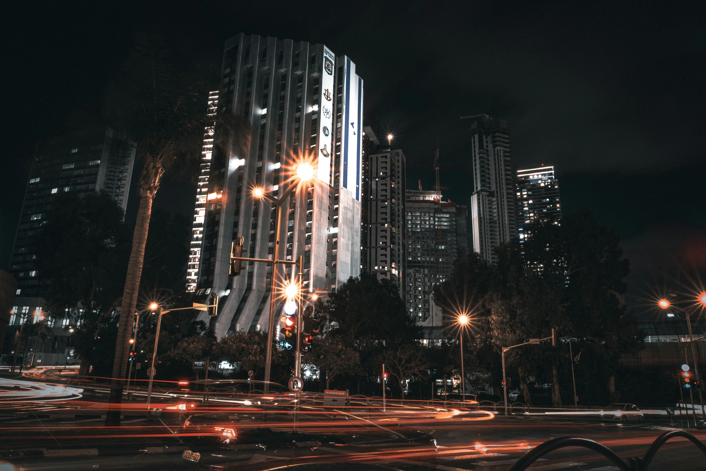 some very pretty tall buildings in the dark night time